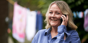 Lady with blonde hair talking on a mobile phone