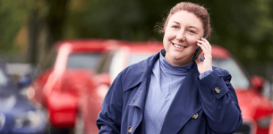 Lady with brown hair talking on a mobile phone